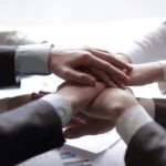 closeup-people-holding-hands-together-hands-together